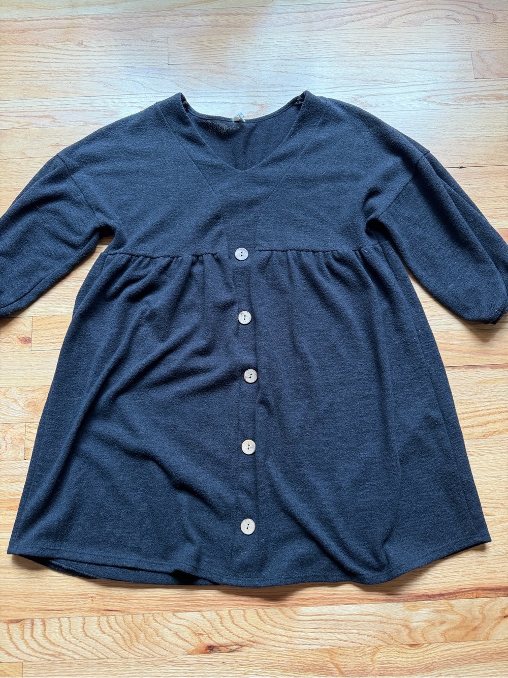 Beeson River Knee-length black empire-waist dress with button details